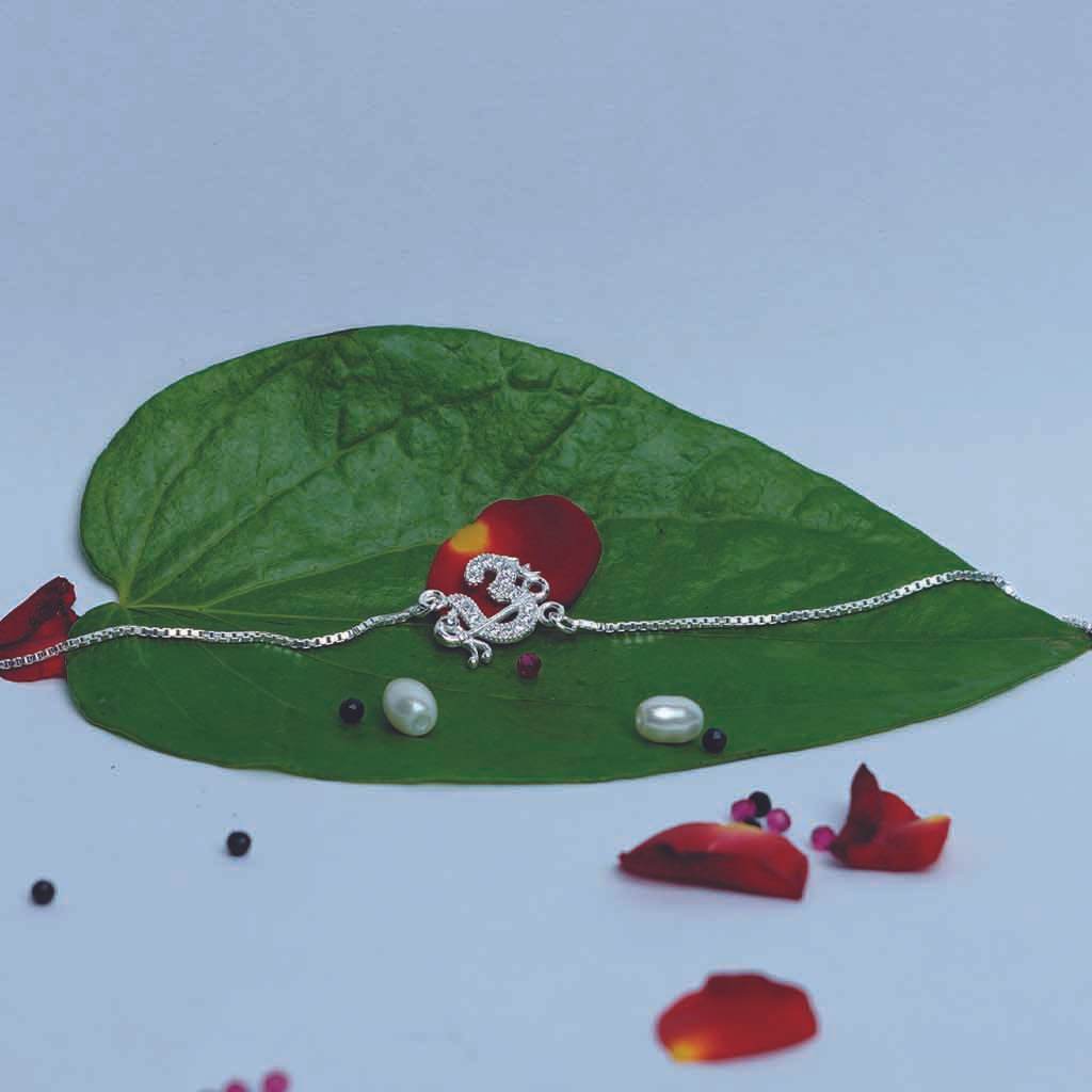 Om Flute Chain Rakhi - Mayuri Silver House